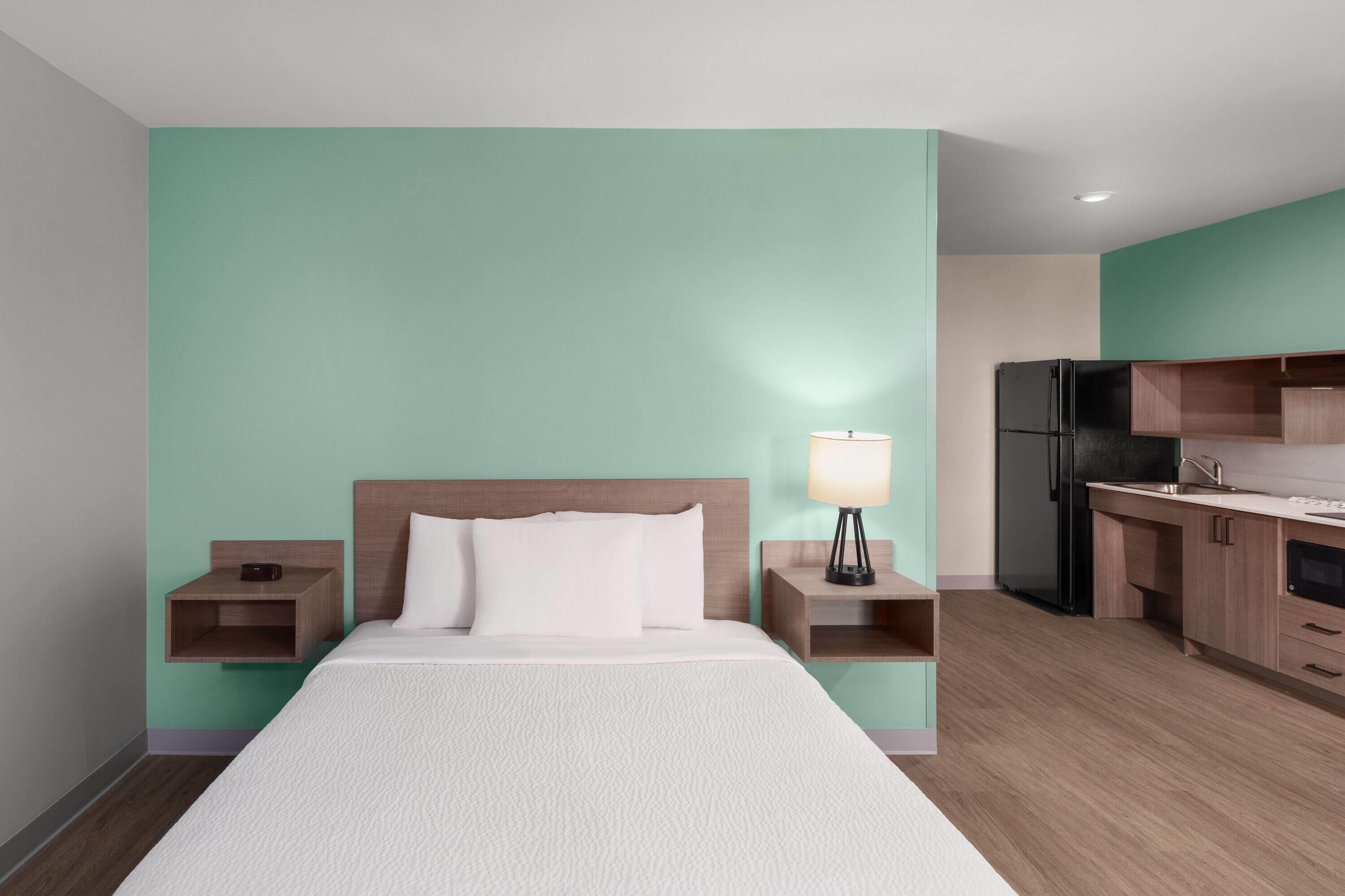 Hypo-allergenic bedding, desk, laptop workspace, blackout curtains