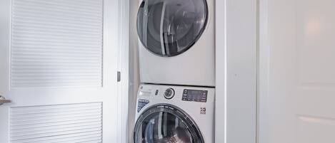 A laundry room with two front-loading washing machines.