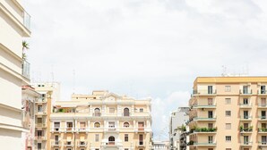 A multi-story building with balconies and windows, typical of urban residential architecture. - [Bari Oberdan Home & Charm 1] Central Apartment (Bari)