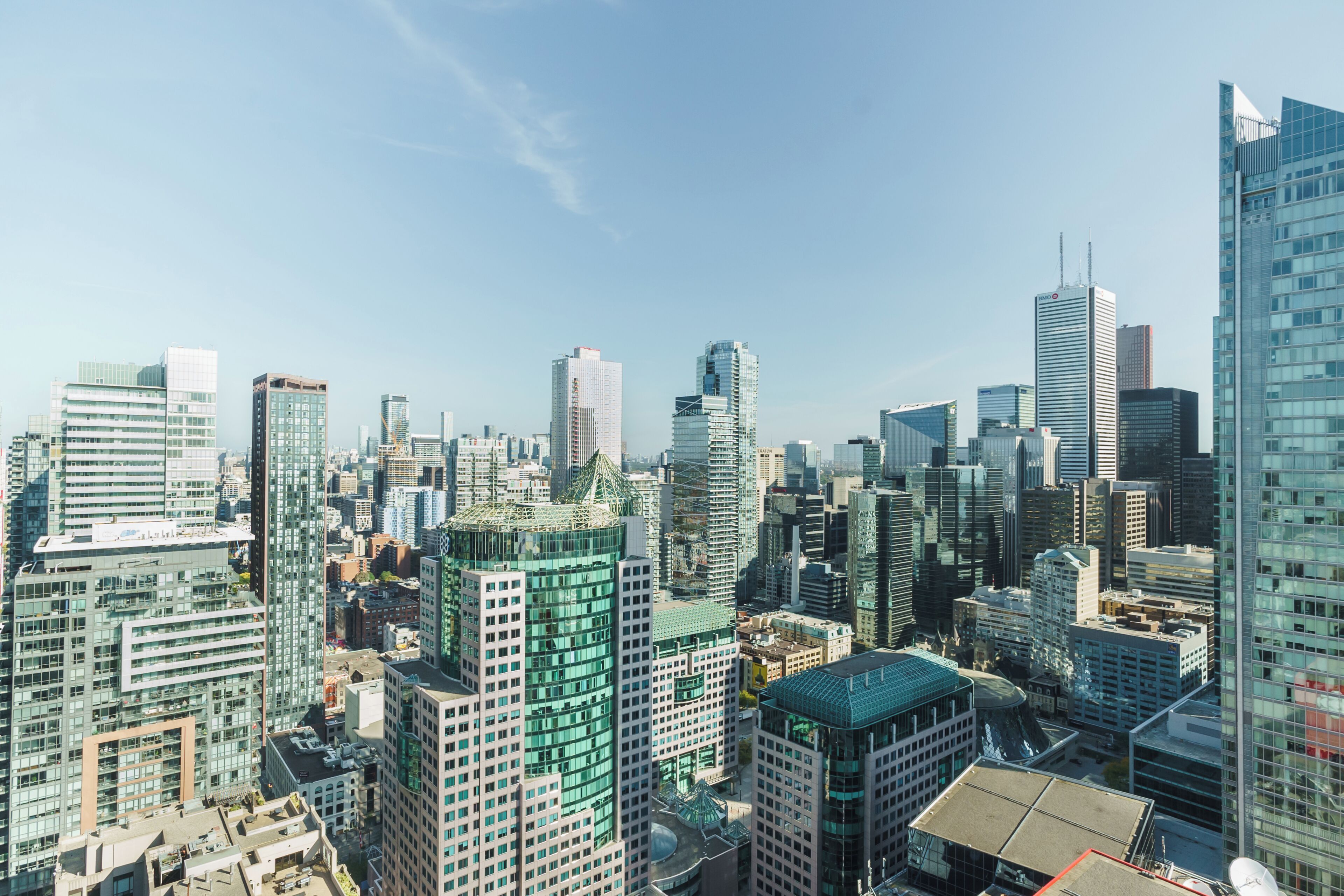 A high-rise urban skyline with modern architecture and a mix of glass and concrete buildings.