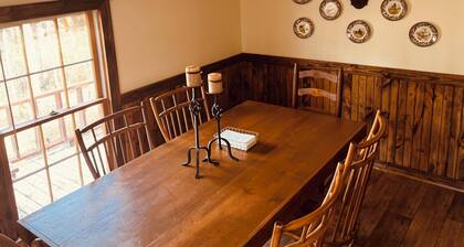 River's Bluff is a 3-bedroom cabin in pleasant Enigma with cozy charm!
