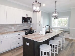 Fridge, microwave, oven, stovetop - Stunning 4-Bed with Ocean View in Ocean Lakes Golf Cart | Site 1199 (Myrtle Beach)