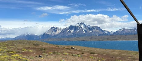 A mountainous landscape with a lake and a clear sky.