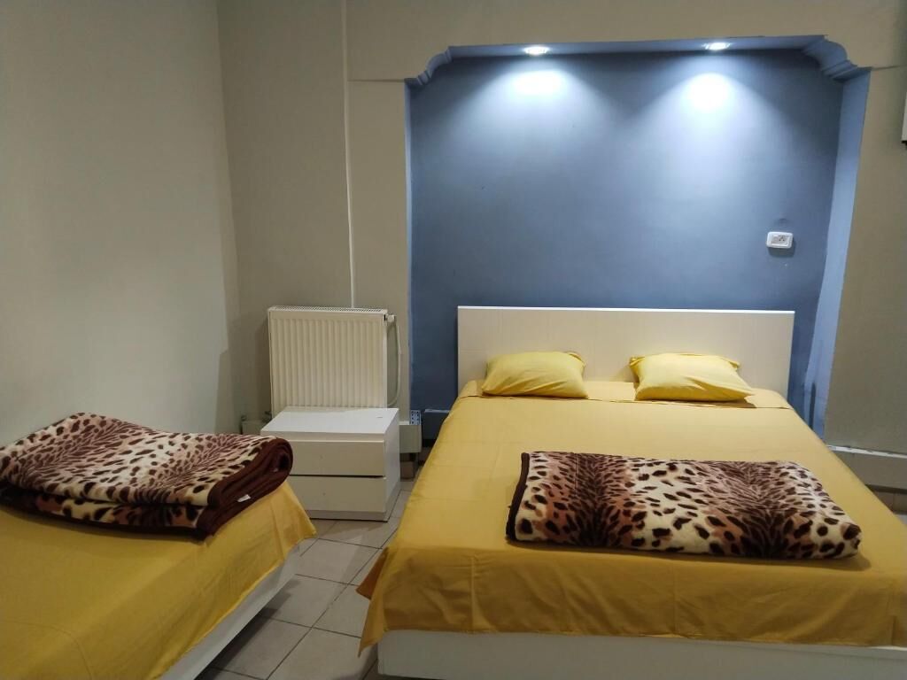 Chambre Triple, vue ville | Wi-Fi gratuit