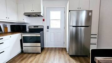 Fridge, microwave, oven, cookware/dishes/utensils