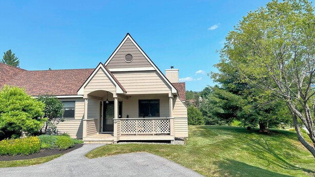 A single-story house with a gabled roof, a front porch with a lattice railing, and a driveway leading to the entrance. - Fv22 Great Location Close to Bretton Woods Ski Area (Bretton Woods)