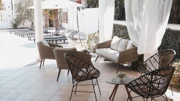 An outdoor seating area with wicker chairs and a sofa, a small round table, and a white canopy. - Hotel Orion Vodice - Double bed with balcony 5 (Vodice)
