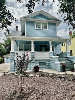 A two-story house with a porch, a chimney, and a number '408' on the front wall.
