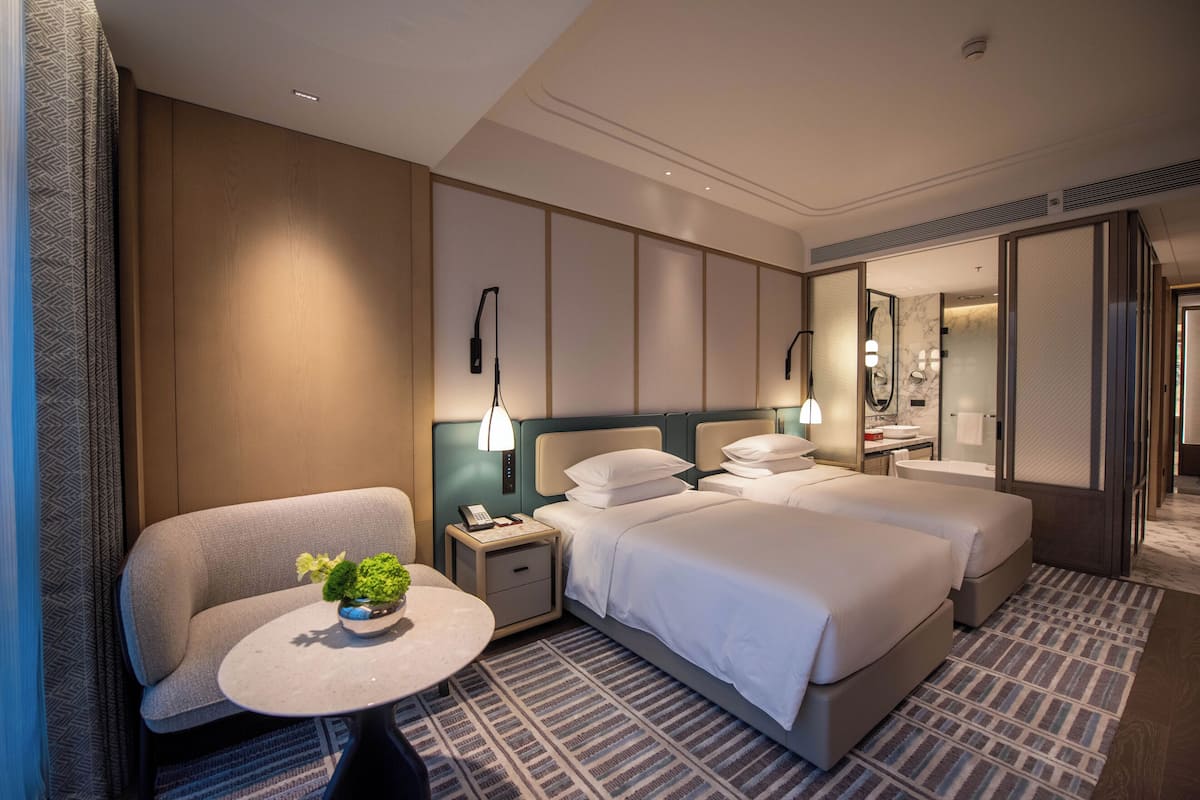 Premium bedding, down comforters, pillowtop beds, minibar
