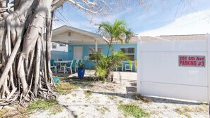 A building with a parking sign indicating "201 8th Ave Parking #3". - 3 Min Walk to Beach | Modern Coastal Retreat (Indian Rocks Beach)