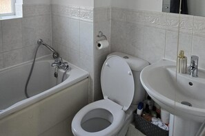 Combined shower/bathtub, deep-soaking bathtub, hair dryer, towels