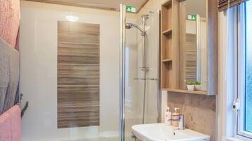 Separate tub and shower, deep soaking tub, hair dryer, towels