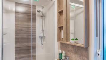 Separate tub and shower, deep soaking tub, hair dryer, towels