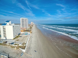 A coastal hotel with multiple buildings, a beach, and ocean views. - Three Oars Beach Surf Shack Pool, Oceanview, Game Room (Daytona Beach)