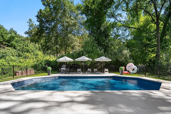Seasonal outdoor pool, pool umbrellas, pool loungers