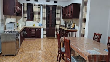 Fridge, microwave, stovetop, cookware/dishes/utensils