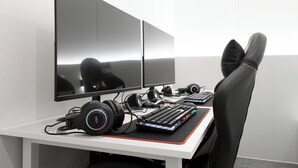 A gaming setup with two monitors, a keyboard, headphones, and a gaming chair. - Bucheon Songnae Number 25 (Bucheon)