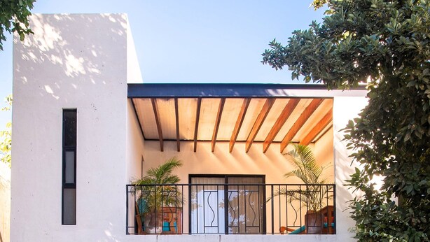 A modern two-story house with a pool, outdoor seating, and potted plants. - Tropical Paradise in Centro Historico of Merida (Merida)