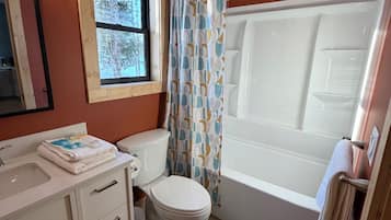 Shower, towels, soap, toilet paper