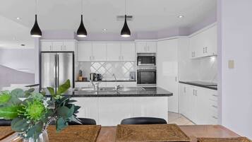 Coffee/tea maker, fridge, microwave, oven