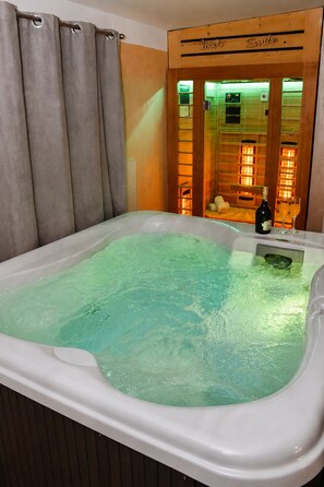 A hot tub with a wooden interior and a sign that reads 'love smile.'