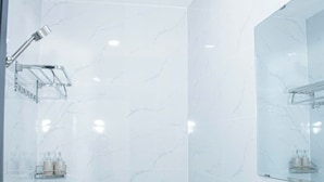 A modern bathroom with a shower, toilet, and sink. - Gia Bao Hotel Thu Duc (Ho Chi Minh City)