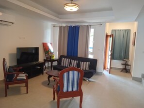 Living area - 3-bedroom apartment in  the heart of  Punta Cana with AC, close to downtown (Punta Cana)