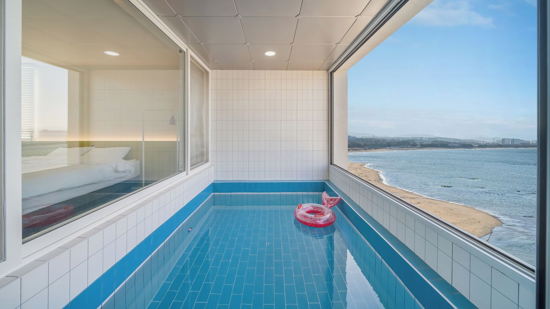 A small, private pool with a view of the beach and ocean.