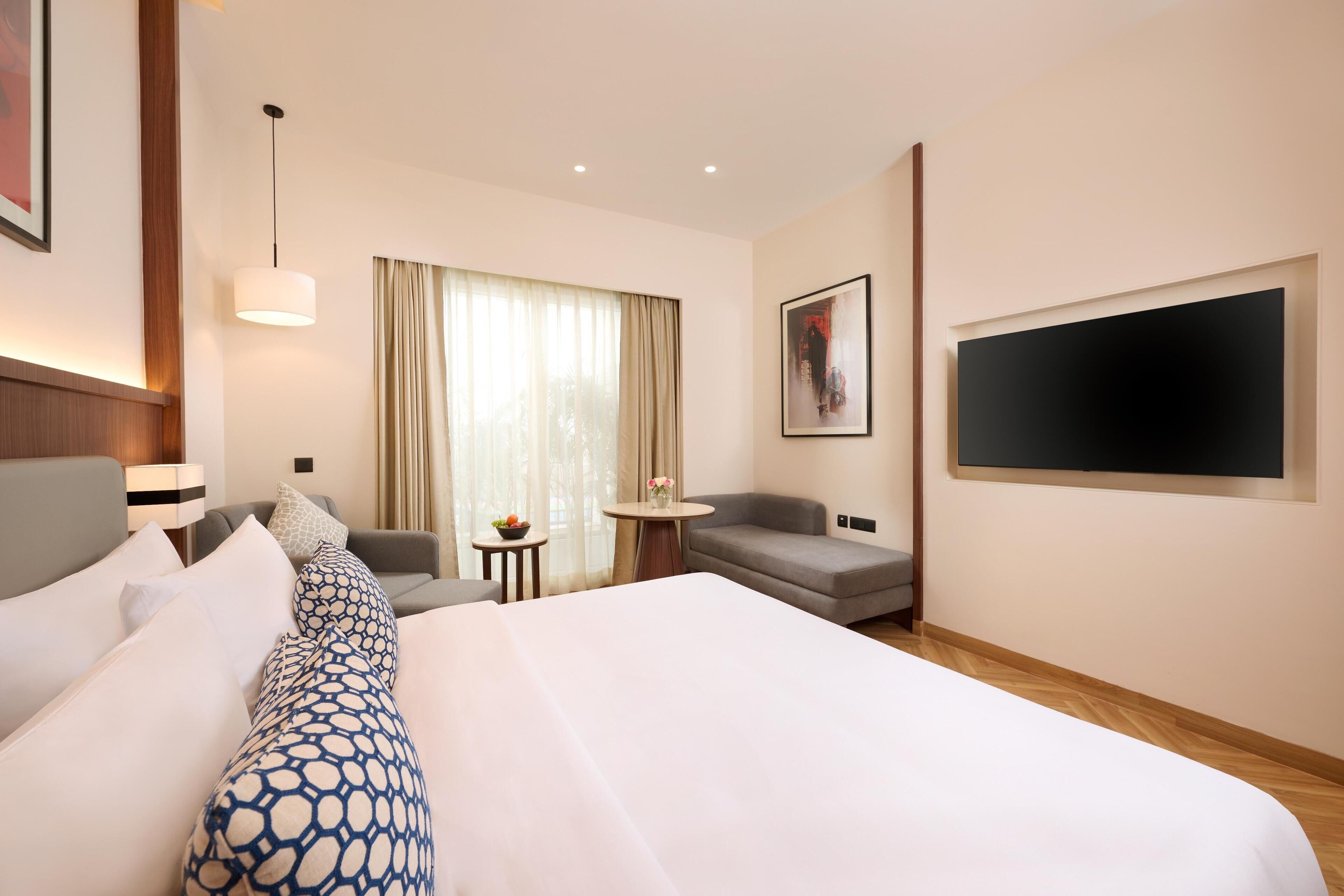 Habitación Deluxe, 1 cama King size | Minibar, caja de seguridad en la habitación y escritorio 