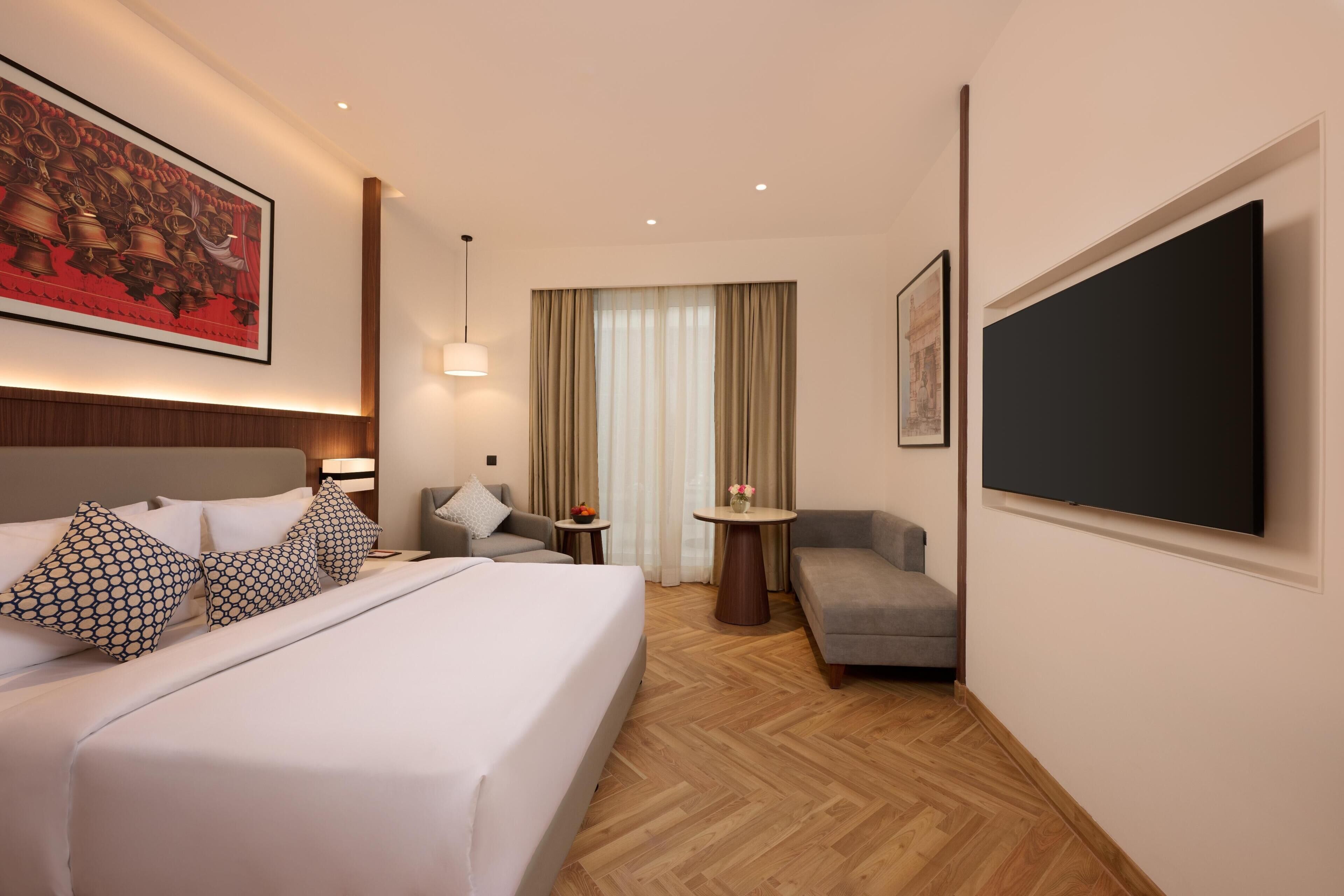 Habitación Premium, 1 cama King size, balcón | Minibar, caja de seguridad en la habitación y escritorio 