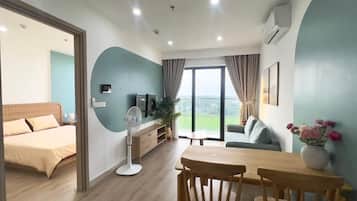 Appartement Deluxe, balcon, vue ville | Coin séjour