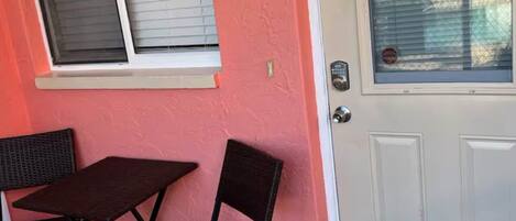 A door with a number '6' and a window with blinds.