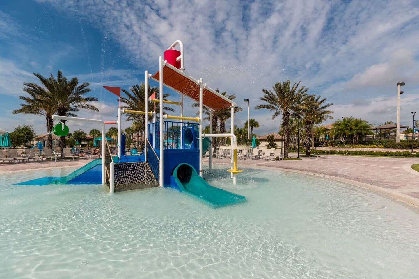 A water play area with a slide and a small pool.