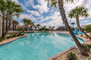 A swimming pool surrounded by palm trees and a clear sky. - 1565 Muligan Blvd, Davenport, 6 BED (Davenport)