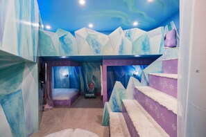 A room with a bed, a chair, and a staircase. - Rc164p Fairway Fun Castle (Kissimmee)