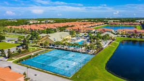 A resort with a large swimming pool, multiple tennis courts, and a lake. - Special Offer Impressive Villa With Pool Close to Disney 2967pp (Kissimmee)