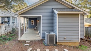 A small, single-story house with a covered porch and an attached garage. - 1 Mi to FSU: Group-Friendly Midtown Getaway! (Tallahassee)
