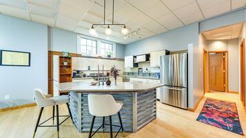 Fridge, stovetop, dishwasher, coffee/tea maker