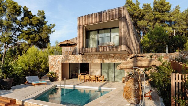 A modern house with a swimming pool, outdoor furniture, and a stone wall. - Pine View Bay, Hvar Island (Stari Grad)
