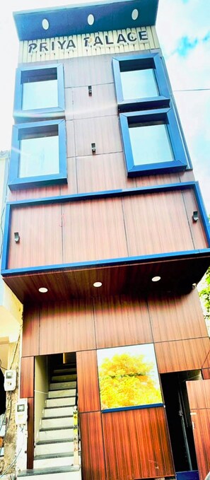 A multi-story building with a sign reading 'PRIYA PALACE'. - PP GUEST HOUSE (Agra)
