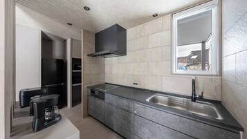 Apartment | Private kitchen | Fridge, microwave, stovetop, cookware/dishes/utensils