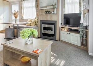 TV - This comfortable stylish caravan offers beautiful sea and country views. (Dorchester)