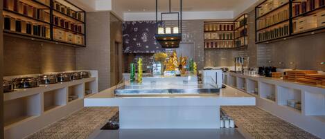 A modern interior with a central display area, surrounded by shelves with storage containers.