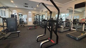 A gym with treadmills, weight machines, and exercise equipment. - PHOENICIAN RESORT- Renovated 2 Bed + 2 Bath Unit in the Heart of Broadbeach (Broadbeach)
