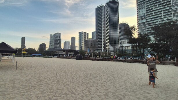 A beach with a tent and a boardwalk. - PHOENICIAN RESORT- Renovated 2 Bed + 2 Bath Unit in the Heart of Broadbeach (Broadbeach)