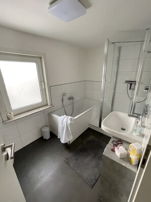 Shower, hair dryer, towels