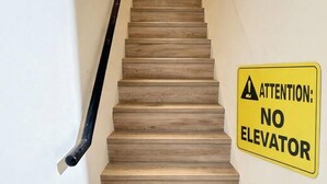 A staircase with a yellow caution sign stating "ATTENTION: NO ELEVATOR". - 35APT- Self Check In (Taipei)