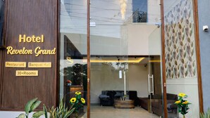 Hotel Revelon Grand with a glass entrance, a restaurant, banquet hall, and 30+ rooms. - Revelon Grand Hotel (Indore)