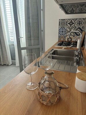 Fridge, stovetop, coffee/tea maker, cookware/dishes/utensils