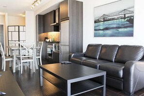 TV - RivetStays | The Atmos Gallery Suite - 1 Bedroom + Den Condo (Toronto)